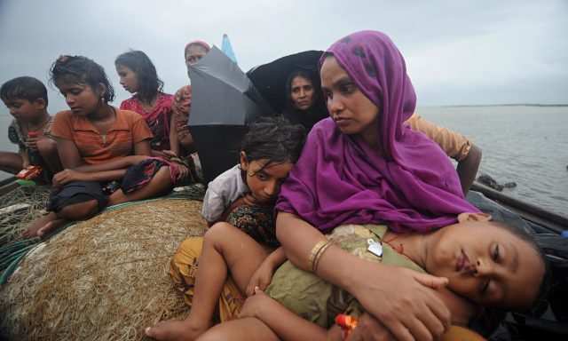 Rohingya muslims trying to cross the Naf river into Bangladesh to escape sectarian violence in Myanm